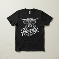 Howdy Darlin' Highland cow illustration hand-pressed graphic tee on a black Gildan Softstyle shirt